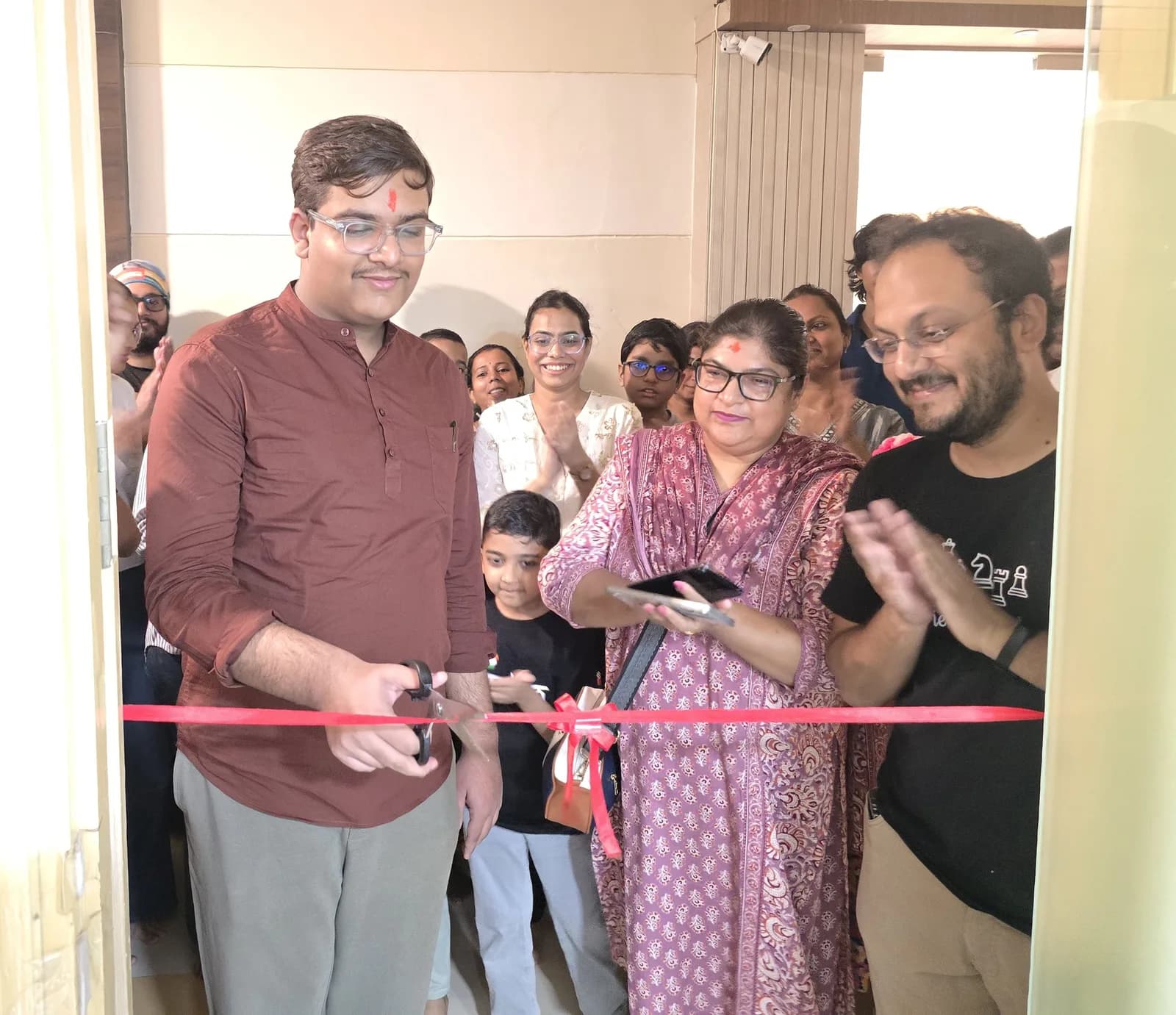 GM Mayank Chakraborty cutting the ribbon at the new Temple of Chess space